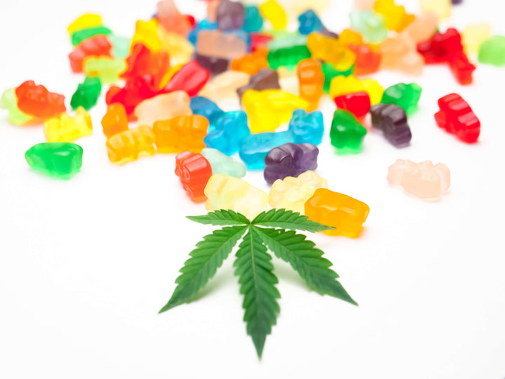 Premium cannabis leaf with assorted gummy candy